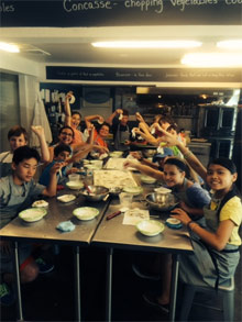 Learning cooking skills at camp